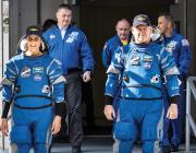 NASA astronauts walk toward camera