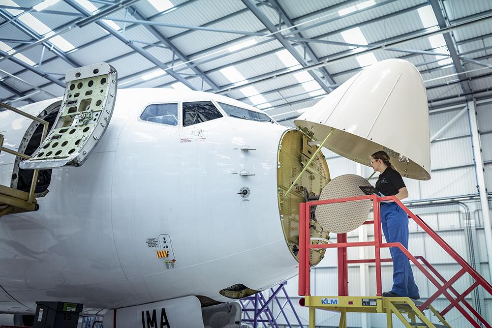 Technician working on aircraft