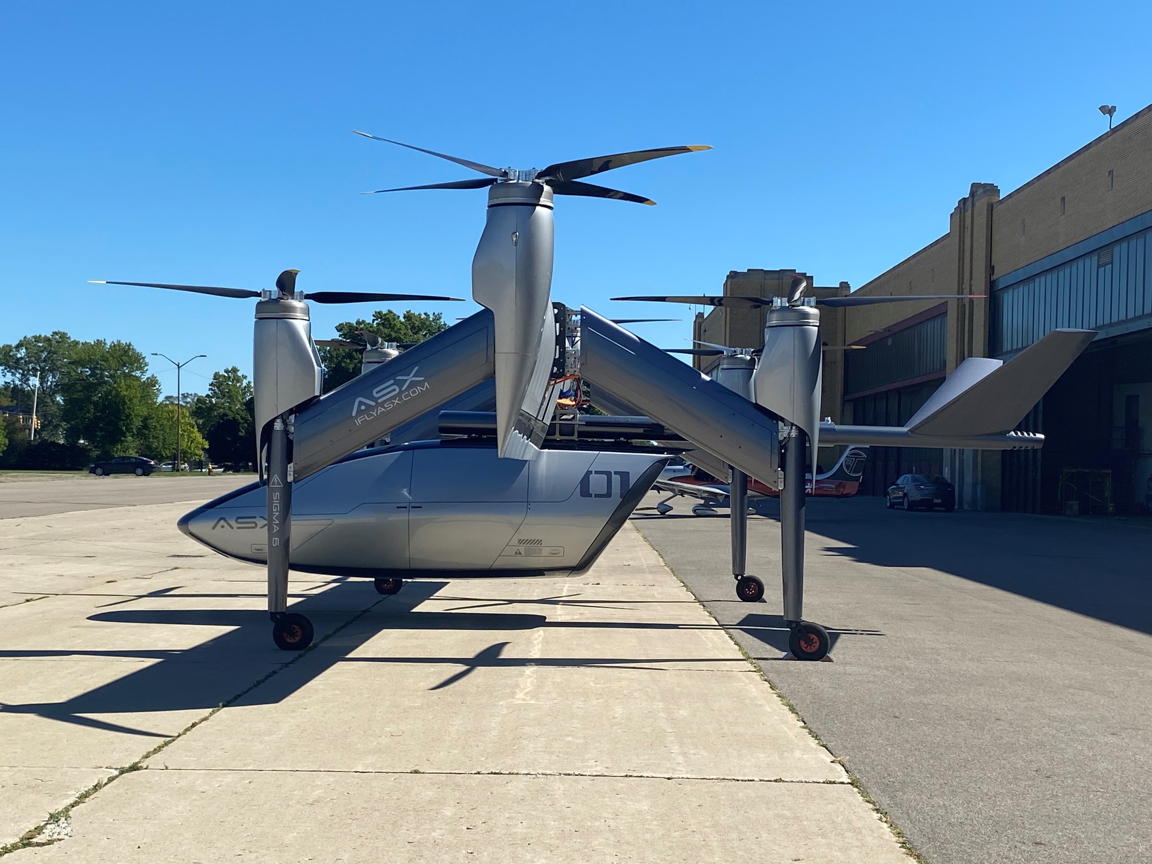 ASX Flies Tiltwing eVTOL Air Taxi Demo With Plug-And-Play Payloads - Vimarsana News