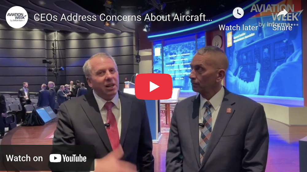CEOs discussing aircraft certification and technology challenges at an industry event.