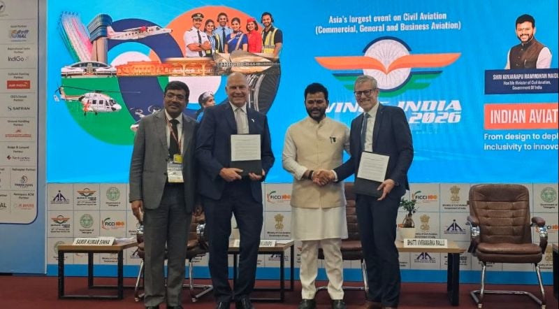Campbell Wilson, CEO & MD Air India and Benoit de Saint-Exup&eacute;ry, Airbus Executive Vice President of Commercial Aircraft Sales, on stage at Wings India 2026 with Honourable Minister of Civil Aviation, India, Kinjarapu Ram Mohan Naidu