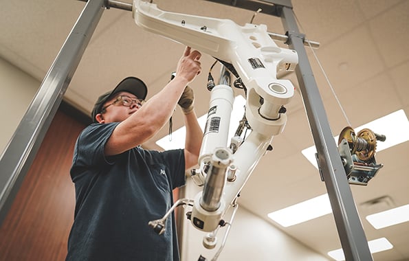 Av8 staff member working on PMA part
