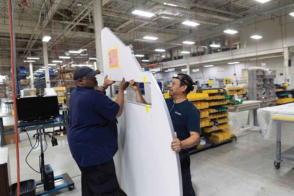 workers assembling aircraft interior