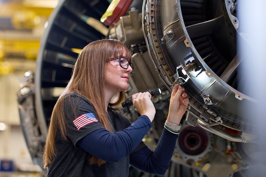 Pratt & Whitney technician with PW1100G-JM engine