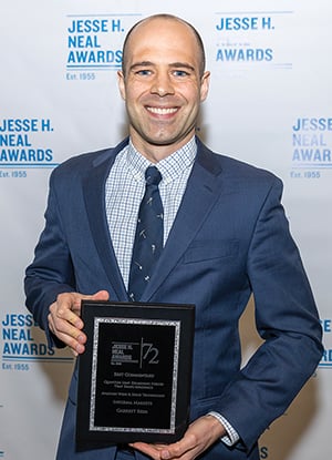 Garrett Reim with his Best Commentary Neal Award
