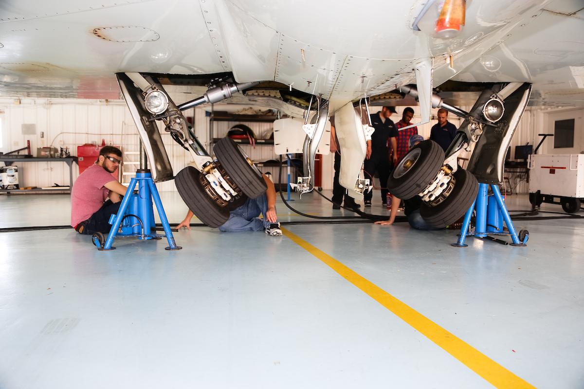 ERAU students work on small jet landing gear