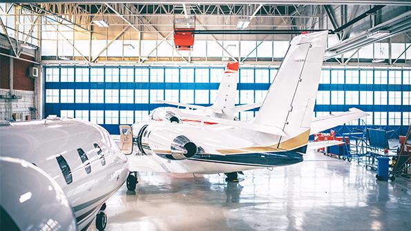 Business jets in hangar