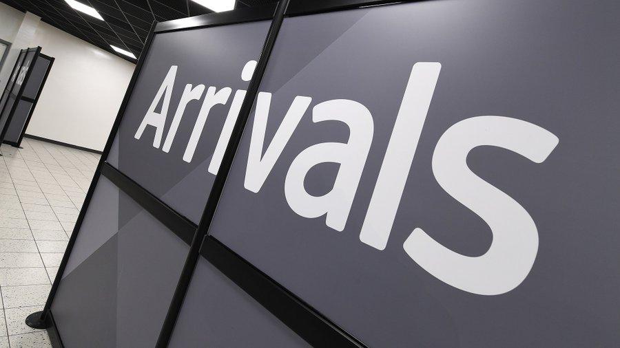 Arrivals sign at London Luton Airport