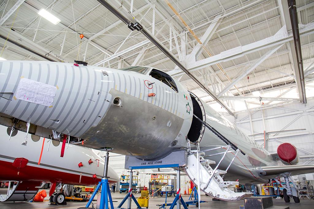 Constant Aviation technicians working a Legacy jet ‘skin change'