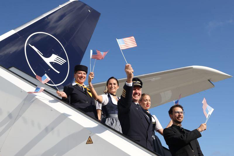 Lufthansa crew waving American flags