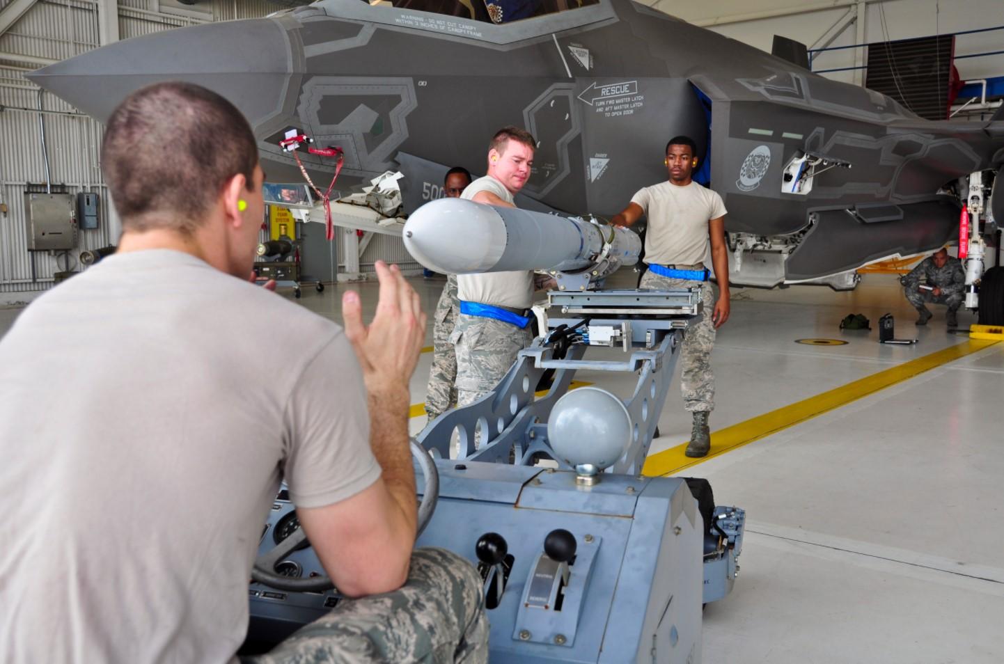 AIM-120 being loaded o to an F-35