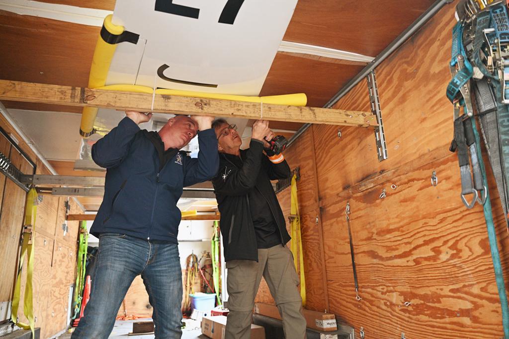 Keith Nuhfer and Dave Carter securing removable wing of Once More