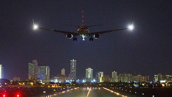 aircraft approaching runway at night