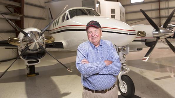 don bateman standing in front of King Air C-90 airplane used for experimental product development at Paine Field in Everett, Washington