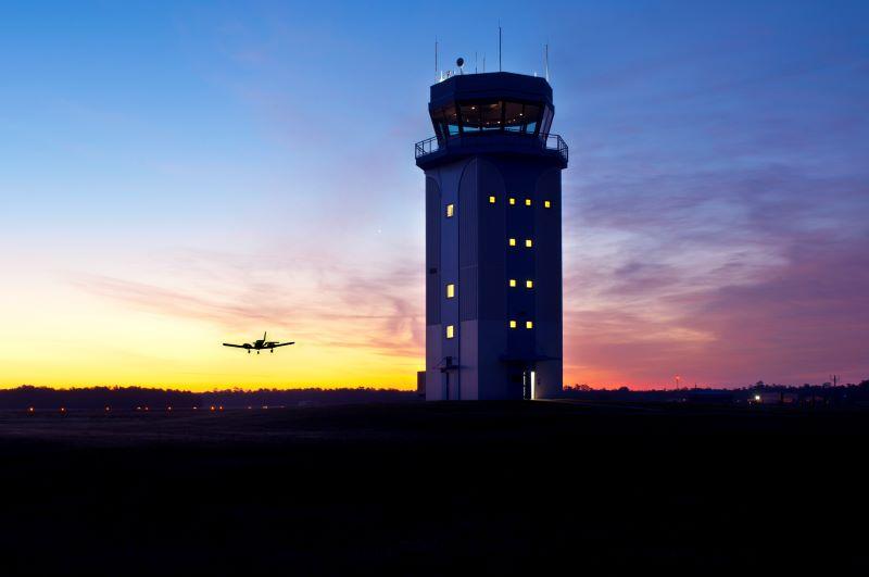 ATC tower and plane landing