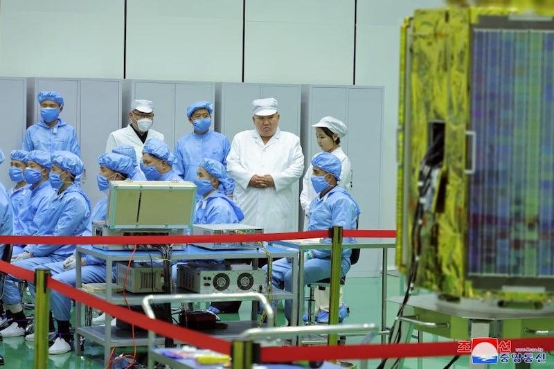 North Korean leader Kim Jong Un inspecting a satellite facility