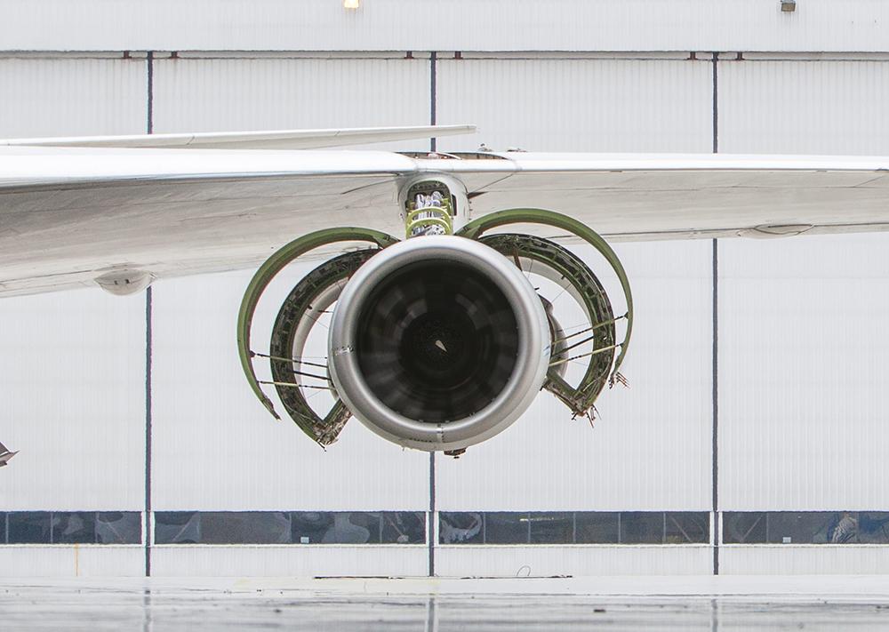 Pratt & Whitney PW1900G engine in front of hangar