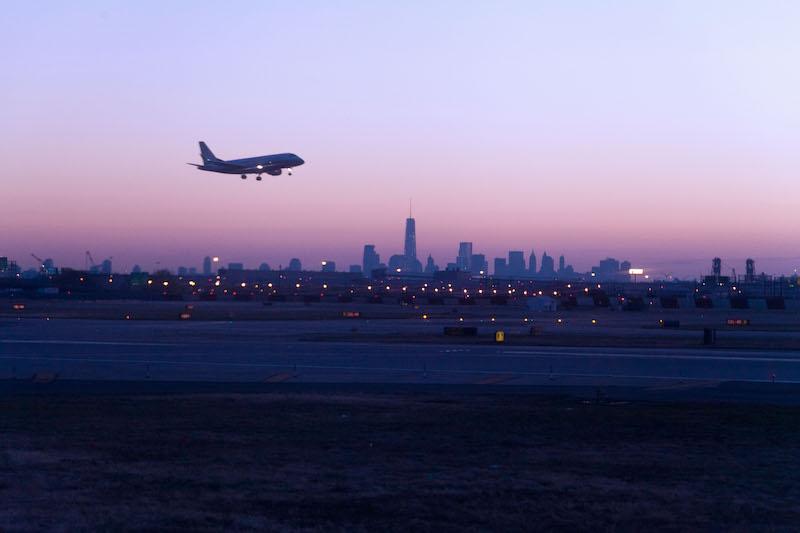 plane landing Newark sunset