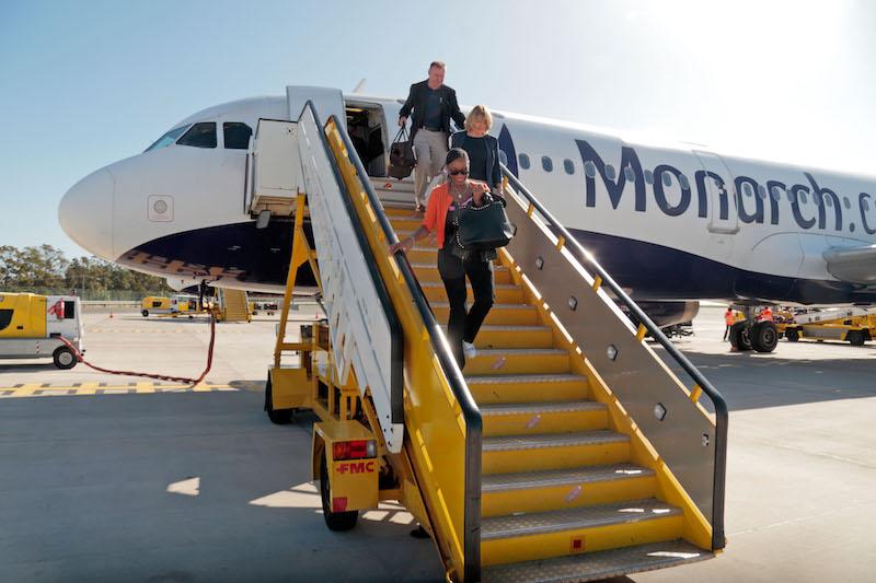 monarch airlines jet passengers disembarking