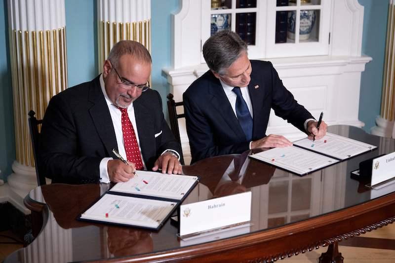 antony blinken and Bahrain's Prime Minister and Crown Prince Salman bin Hamad al-Khalifa signing agreement