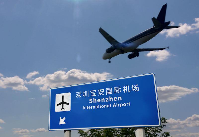 shenzhen airport sign with airplane