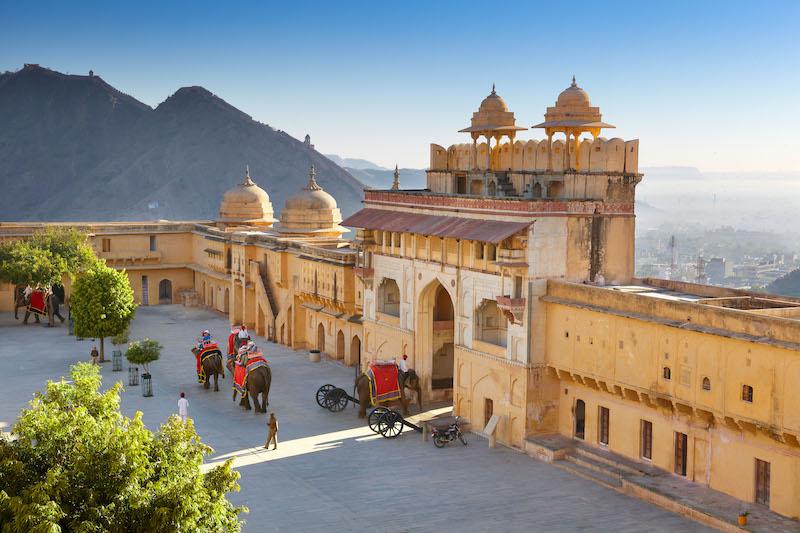 Amber Fort - landscape with elephants on the Jaleb Chowk courtyard and main gate of Amber Fort, Jaipur, Rajasthan, India