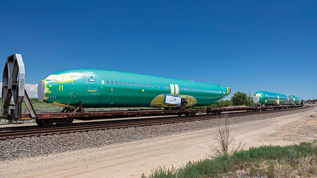 Boeing fuselage being transported by rail