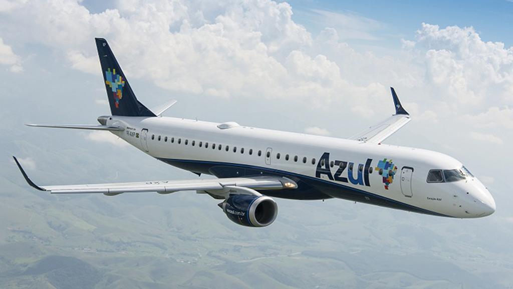 Azul Embraer aircraft flying above clouds