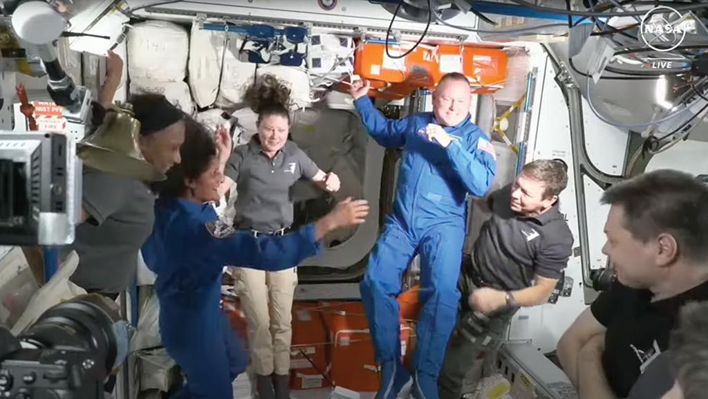 Six astronauts floating inside International Space Station