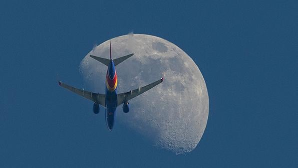 Southwest Airlines aircraft flying past Moon