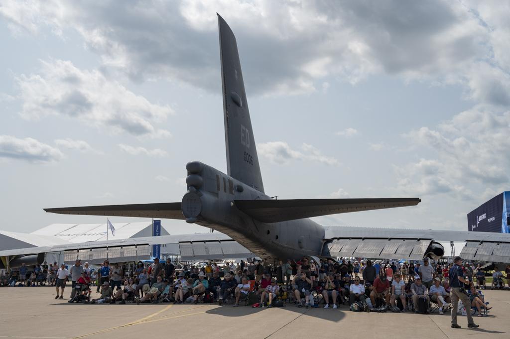 Crowd in shade of B-52's wing