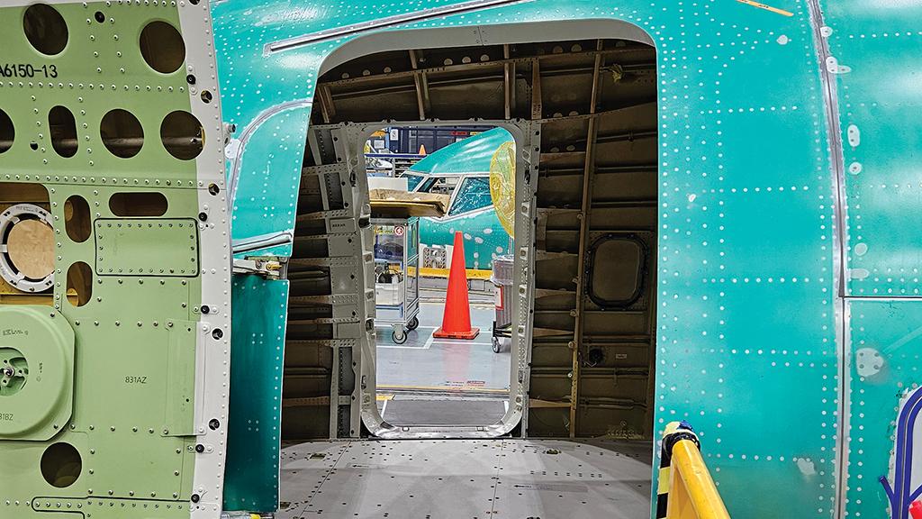 Door view through aircraft fuselage in factory