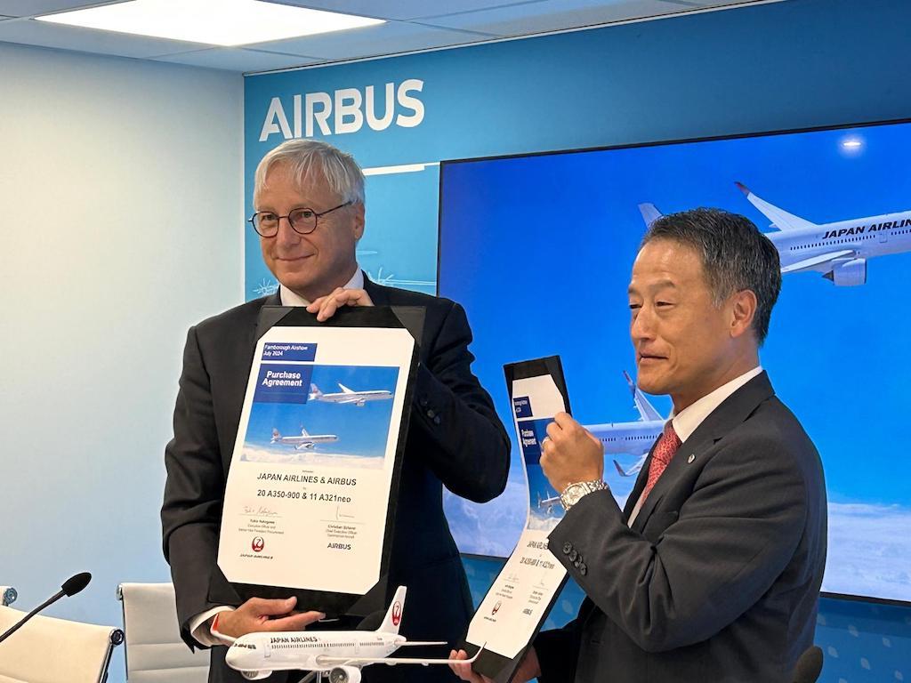 Airbus Commercial Aircraft CEO Christian Scherer and JAL procurement SVP Yukio Nakagawa.