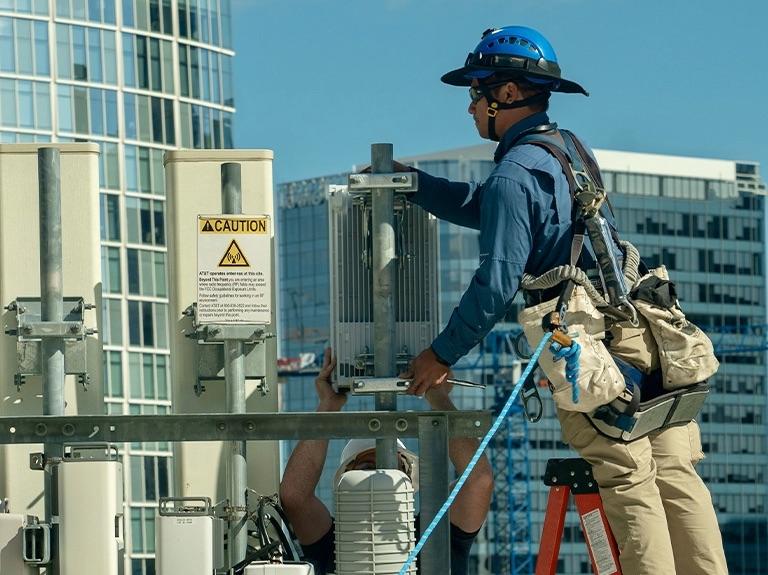 AT&T technicians install 5G transmitter components