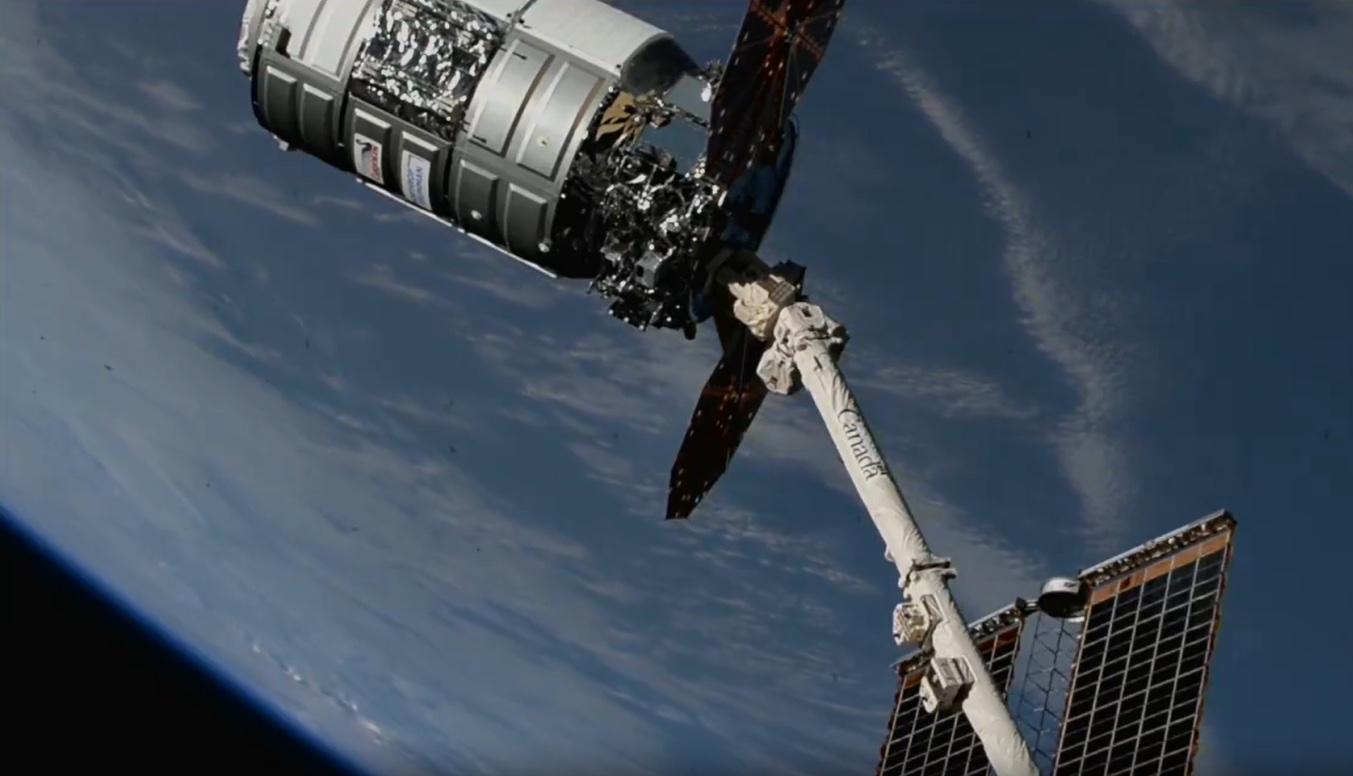 Northrop Grumman’s Cygnus spacecraft is pictured attached to the Canadarm2 robotic arm moments after NASA astronaut Matthew Dominick maneuvered the robotic arm to capture the spacecraft ahead of installation to the Earth-facing port of the Unity module