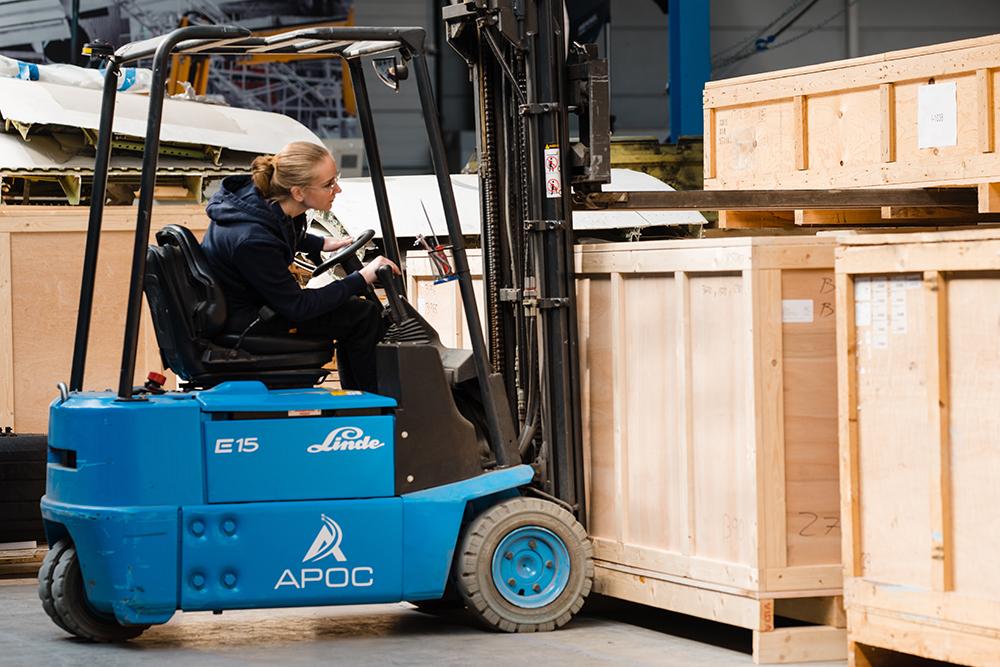 Worker in aviation parts warehouse