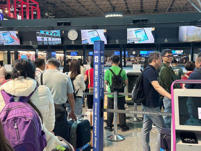 passengers checking in at Taipei Taoyuan airport