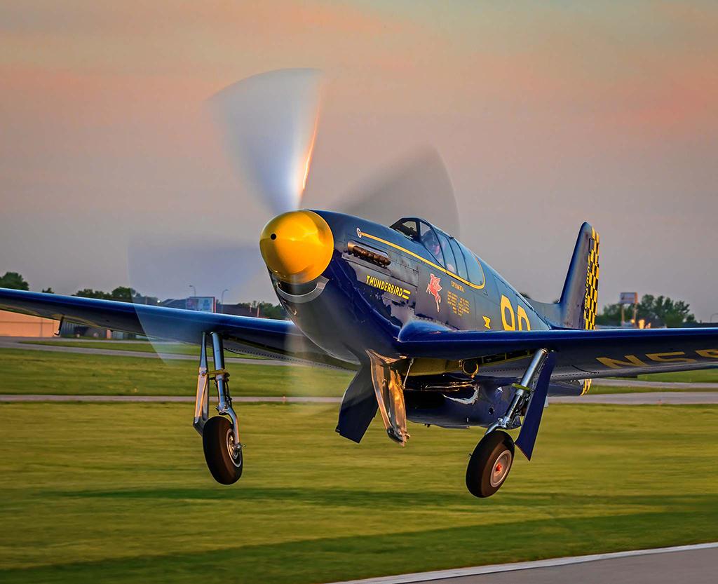 Pilot Bernie Vasquez performs a formation takeoff with this P-51C Mustang at the Minot International Airport, Minot, North Dakota.