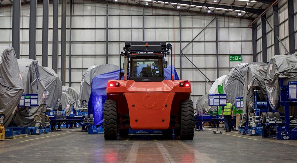 Equipment transporting aircraft engine in hangar