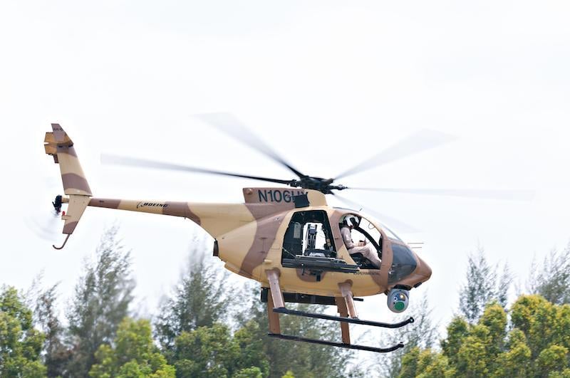 boeing ah-6i little bird in flight