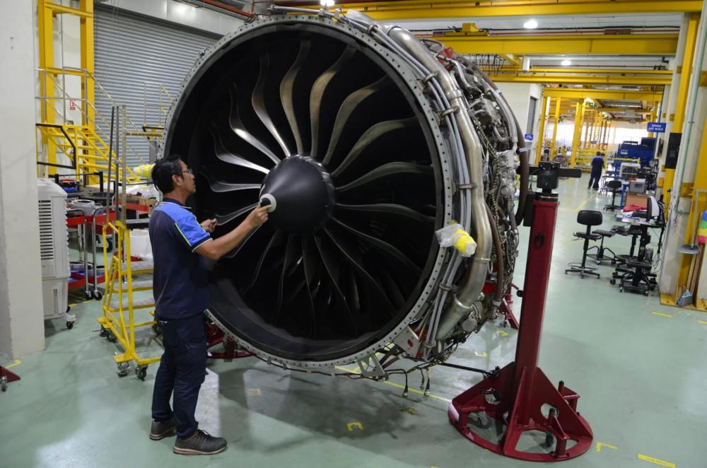 Technician working on engine