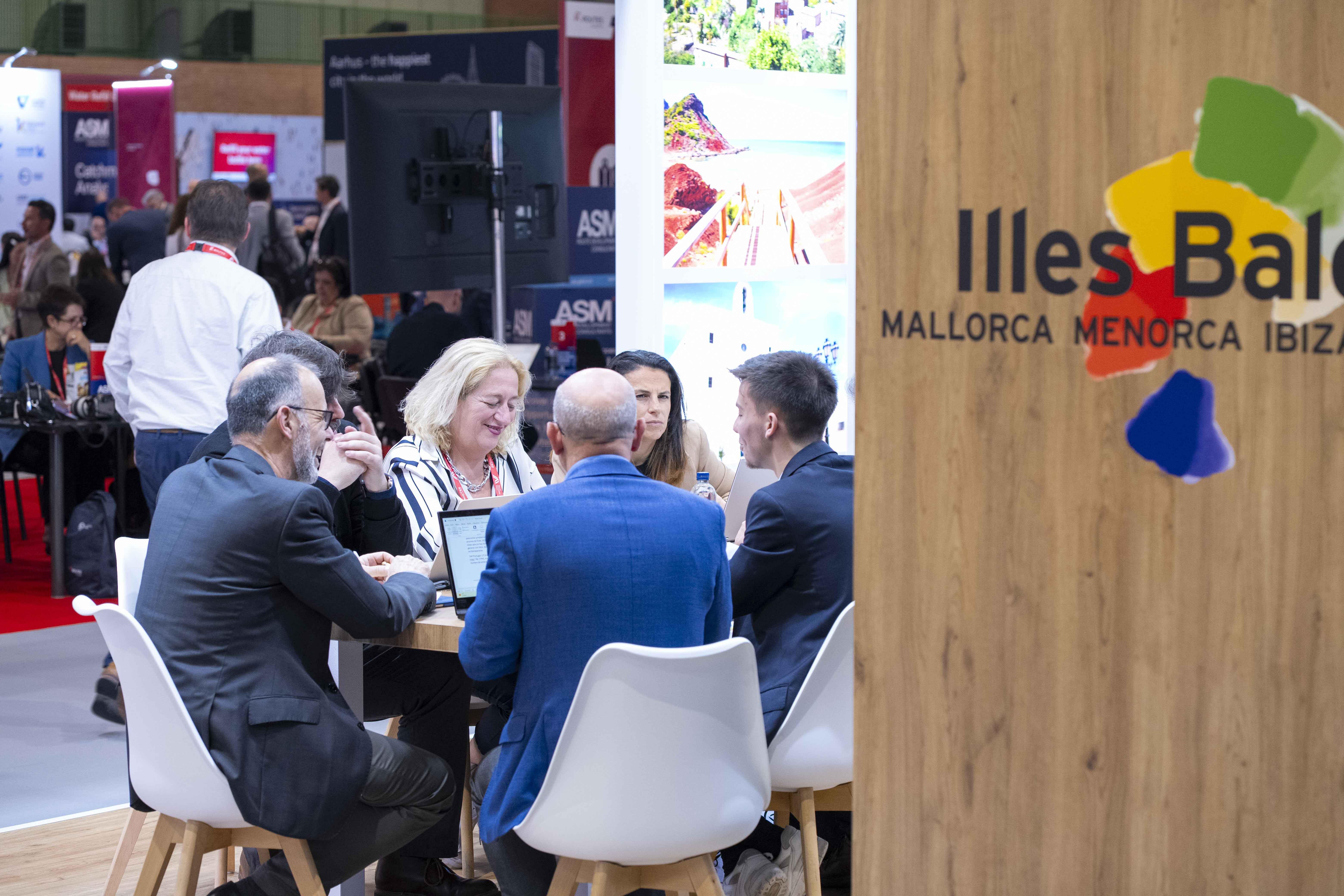 Delegates meet at a stand