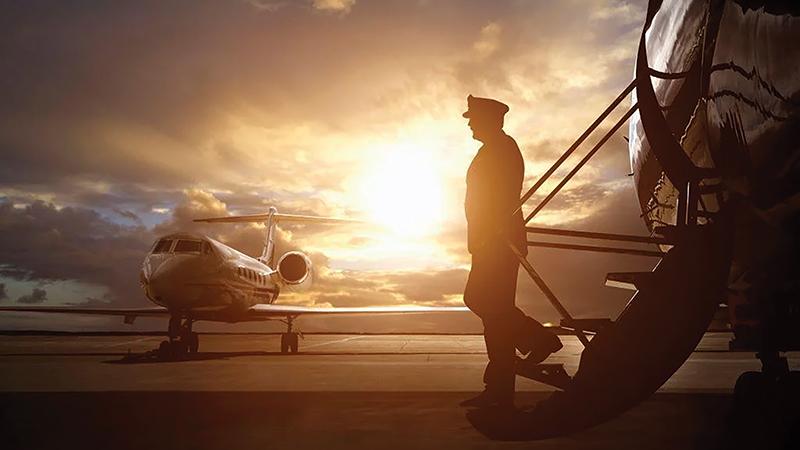 Pilot and aircraft sunset