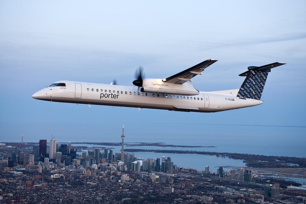 A Porter Dash 8-400 flying over Toronto.