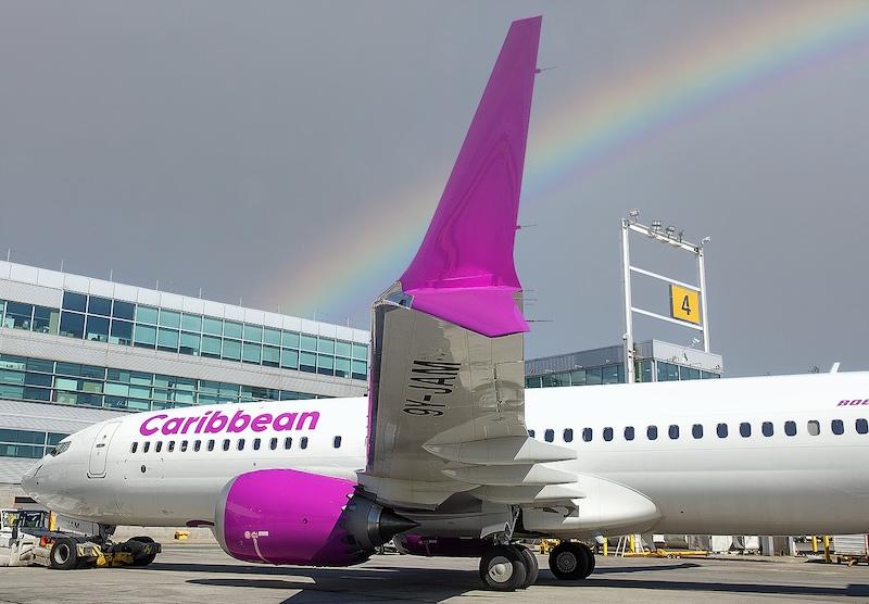 caribbean airlines jet with rainbow in background