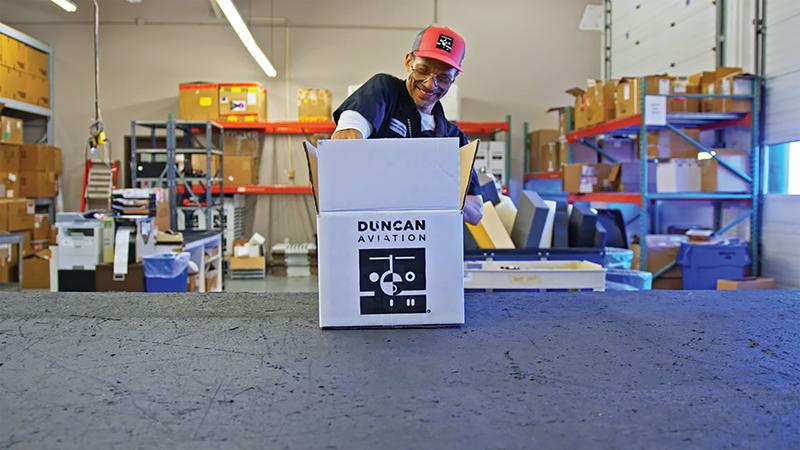 Sales representative packs an order