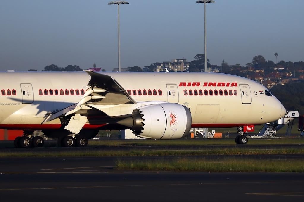 An Air India Boeing 787 taxiing on a runway at Sydney Airport.