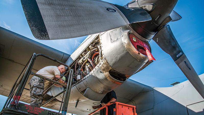 military-trained mechanic working on aircraft