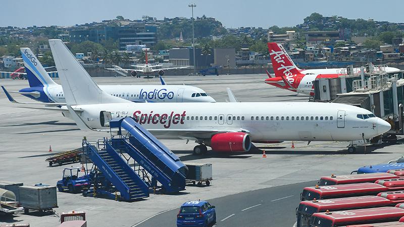 SpiceJet, IndiGo and Air Asia aircraft on runway