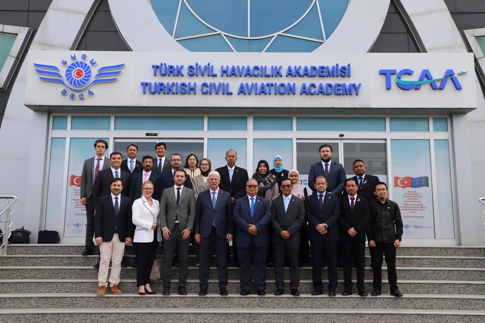 people standing in front of the TCAA